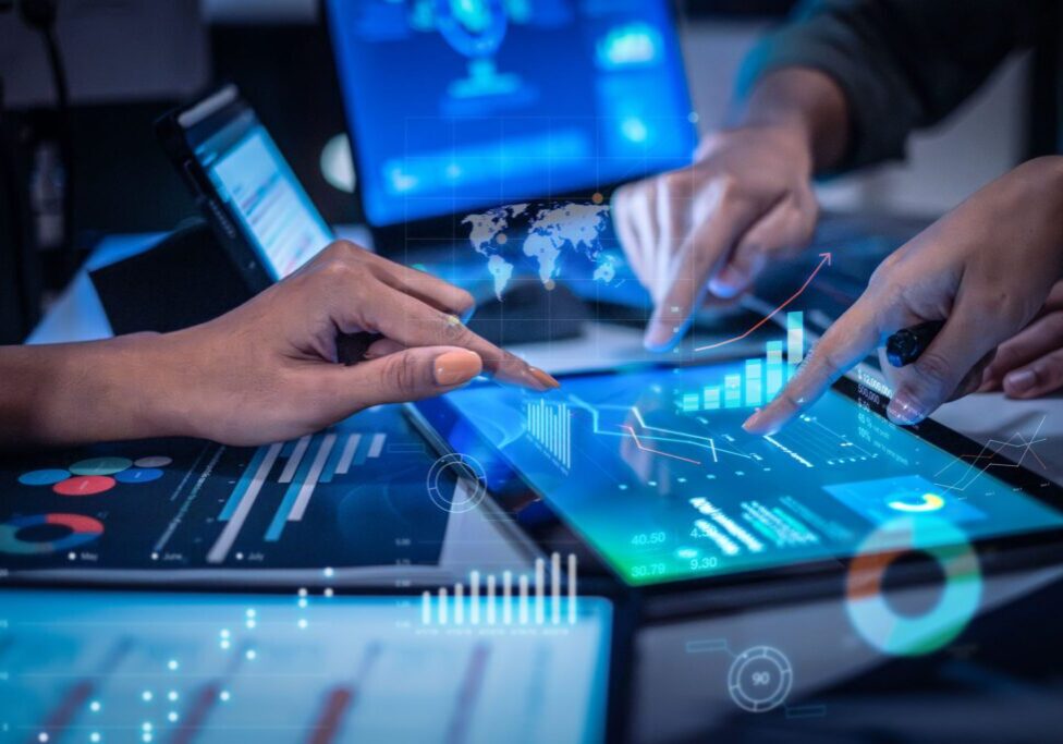 close up hand team of financial discussion fintech  technology planning, analyzing digital financial data and strategy in a modern office at night